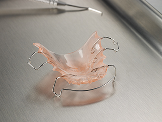 A pink retainer provided by a dental lab